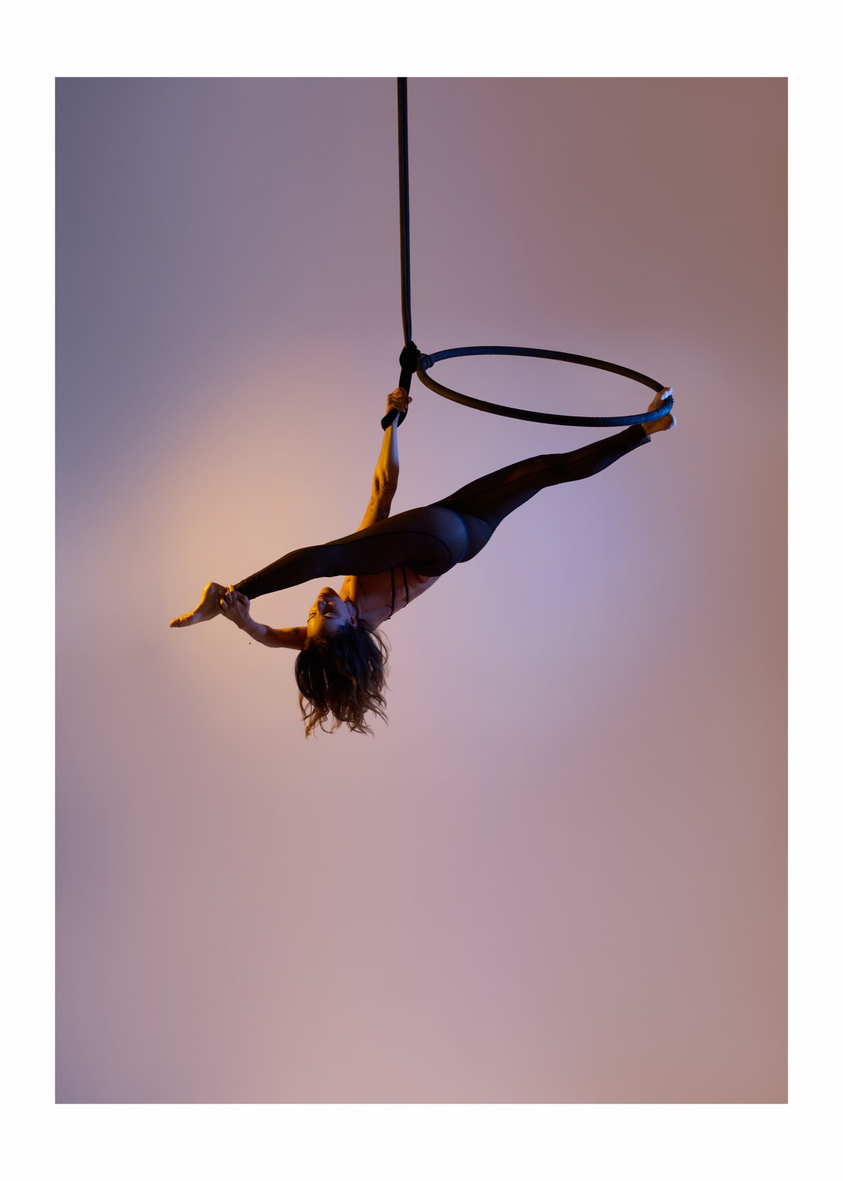 Inverted hang in the aerial hoop at the Pole Lounge studio